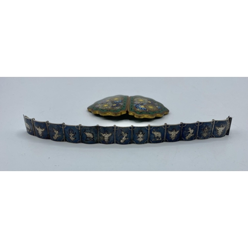 30 - A Japanese Cloisonné belt buckle, Meiji Period together with a Siam silver panel bracelet.