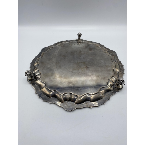 32 - A sterling silver circular tray with central armorial 'Semper Fidelis' (always Loyal). Cast border w... 