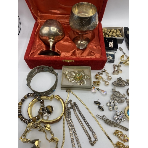 38 - A collection of silver, unmarked white metal and costume jewellery.