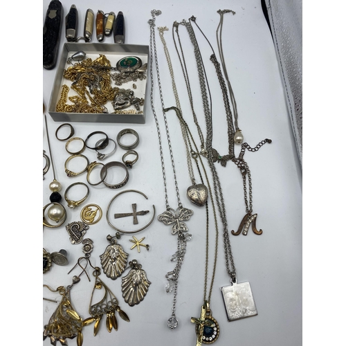 38 - A collection of silver, unmarked white metal and costume jewellery.