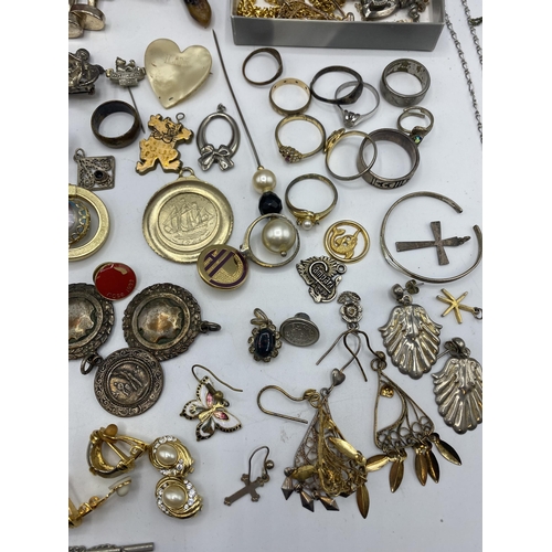 38 - A collection of silver, unmarked white metal and costume jewellery.