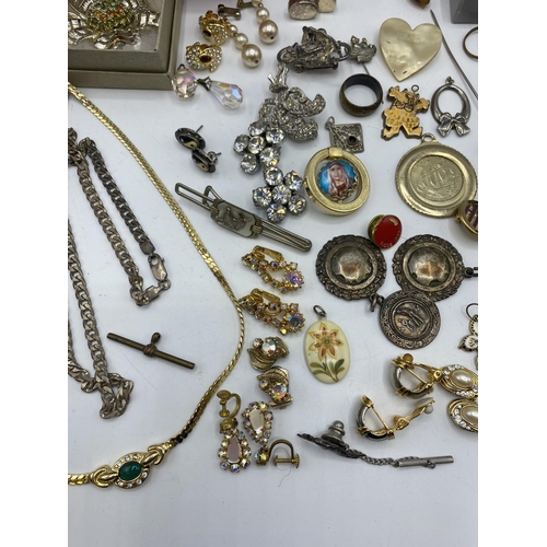 38 - A collection of silver, unmarked white metal and costume jewellery.