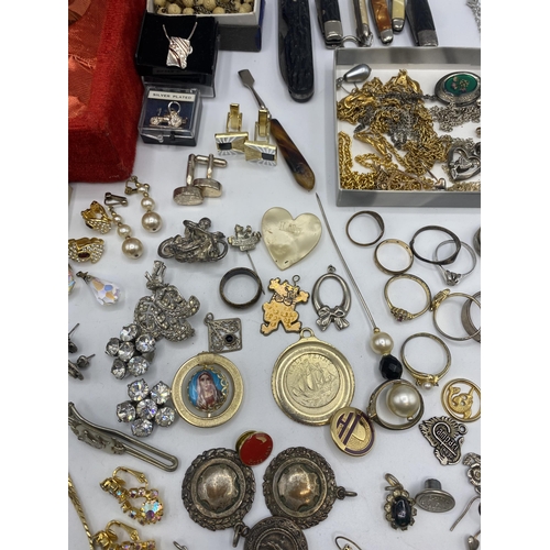 38 - A collection of silver, unmarked white metal and costume jewellery.