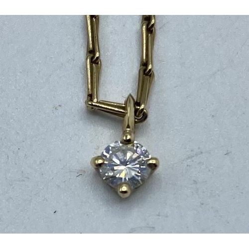 23 - A single stone diamond set pendant on a 9ct gold fancy link necklace. 3.06g.