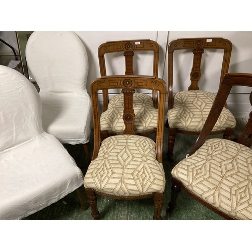 537 - A set of four dining chairs with cream upholstered and brass buttoned over stuffed seats, and two mo... 