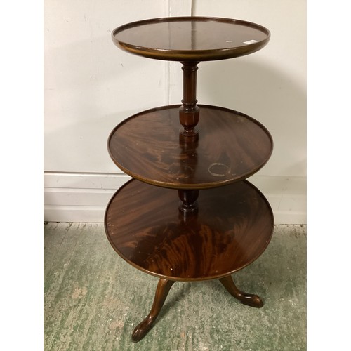 536 - A Georgian mahogany three tier dumb waiter and a Georgian mahogany circular tripod table 53 cm Dia.