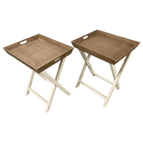 539 - A pair of modern Oka folding white tray tables on stands.