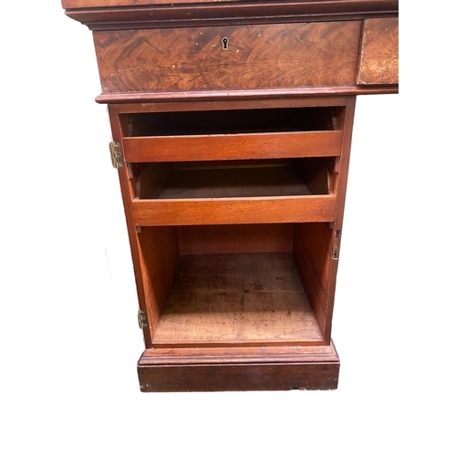 548 - A good William IV mahogany sideboard with three drawers to the top, on pedestal supports opening to ... 