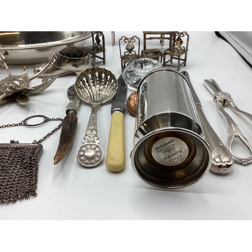 63 - A collection of unmarked white metal items to include wick scissors, dolls house furniture and other... 