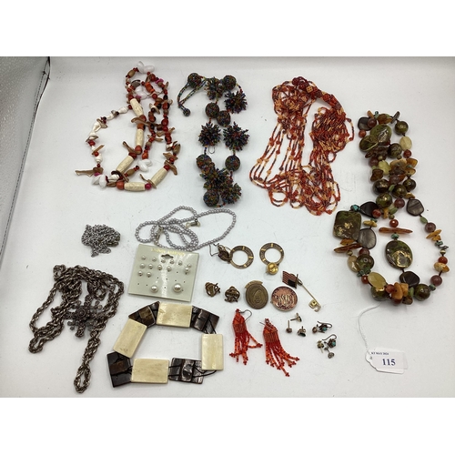 65 - A collection of costume and bead jewellery. A pair of amber drop ear rings. A jet style bead necklac... 