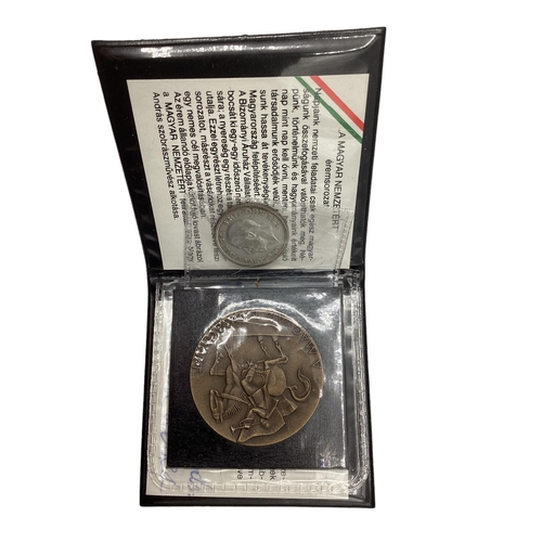 71 - A Hungarian Magyar Nemzetert bronze coin together with a 1927 shilling.