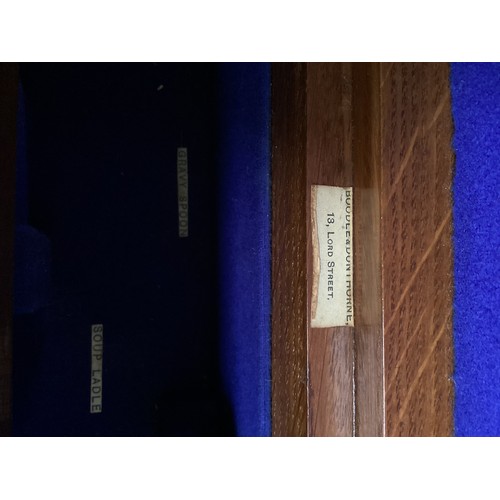 237 - A honey coloured oak vintage cutlery box, with blue fitted interior for cutlery, and brass side hand... 