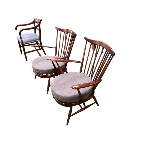 567 - A pair of dark wood Ercol Style stick back chairs