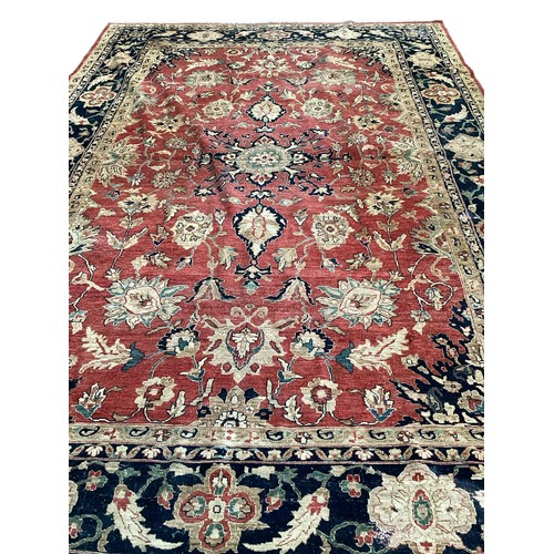 516 - A large good quality red ground rug, some wear and fraying to edge commensurate with age and use 436... 