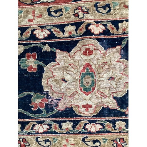 516 - A large good quality red ground rug, some wear and fraying to edge commensurate with age and use 436... 