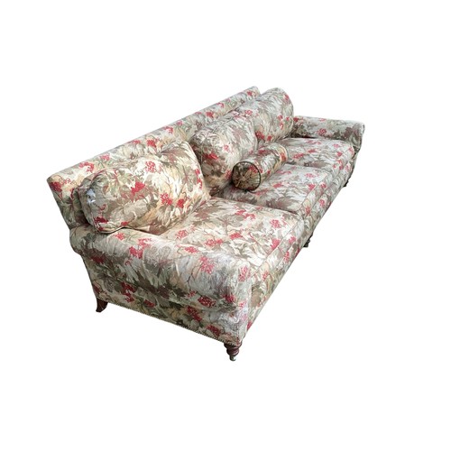 613 - Large good quality three seater sofa, brass studding to base, three turned wooden feet to front, muc... 