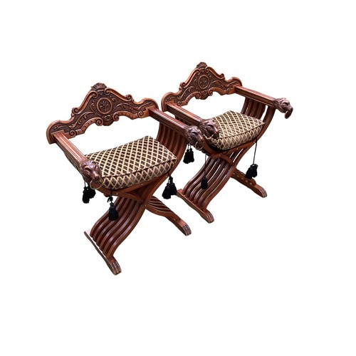 580 - Pair of Anglo Indian Savonarola style throne chairs with Lions head and ring handles arms.