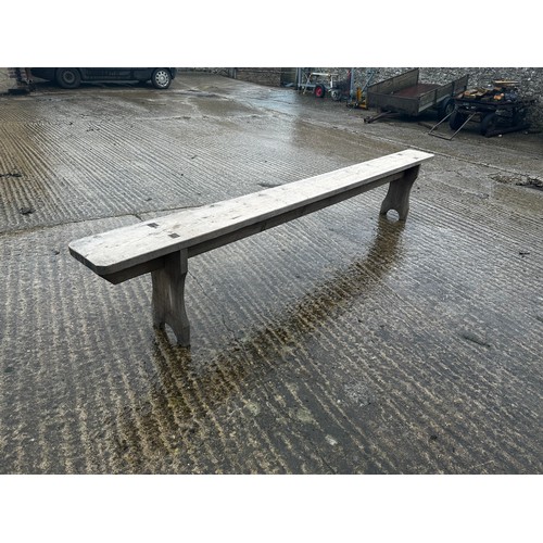 590 - A pair of long oak benches. 274 cm L with  black cushions and a pine bench 274 cm L