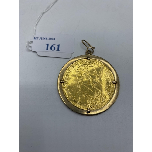 161 - An Austro-Hungarian 4 Ducat gold coin in an unmarked yellow metal mount.19.20g.