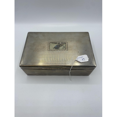 17 - A large sterling silver cedar lined  cigarette/Cigar box. Set with glass panel to top containing a f... 