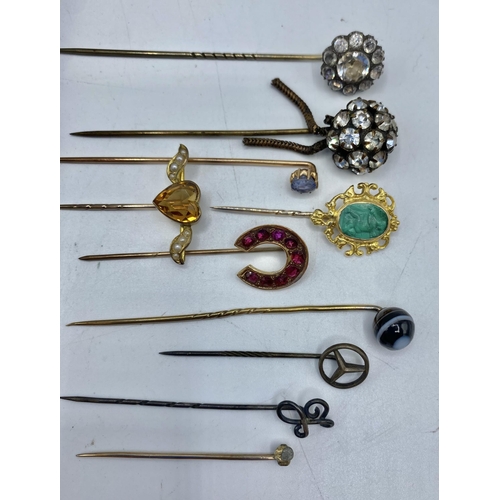 170 - A collection of unmarked yellow and white metal gem and paste set tie pins.