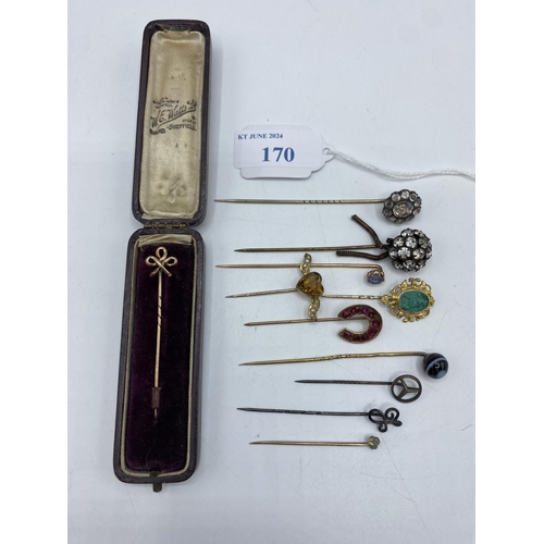 170 - A collection of unmarked yellow and white metal gem and paste set tie pins.