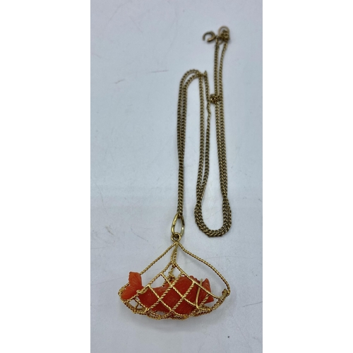 171 - An 18ct gold and pink coral pendant on a 9ct gold chain link necklace. Gross 11g.