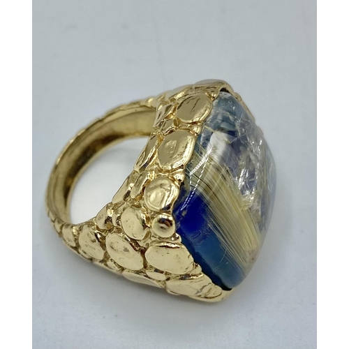 179 - A gilt silver and rutilated quartz set dress ring by Giovanni Bastini. Together with four similar co... 