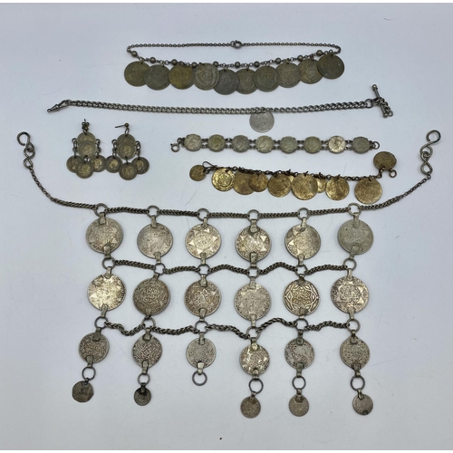 180 - A Moroccan Berber coin set necklace together with other coin set white metal items.