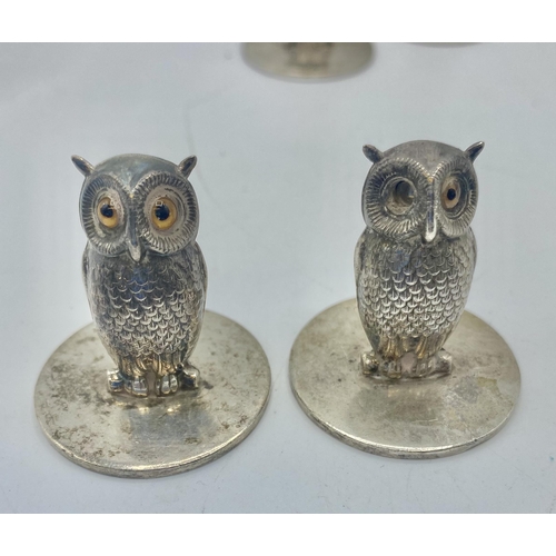 20 - A set of five sterling silver menu or name place holders in the form of owls with glass eyes by Samp... 