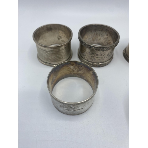 22 - Two pairs of sterling silver napkin holders together with five single examples. (9). 280g