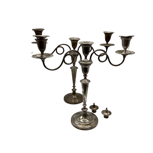 32 - A large pair of white metal candelabra. With bell hallmark in oval cartouche. 42cm x 46cm.