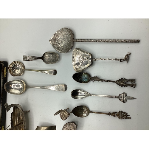 34 - A collection of sterling silver and white metal items to include a boxed set of gilt Royal Regiment ... 