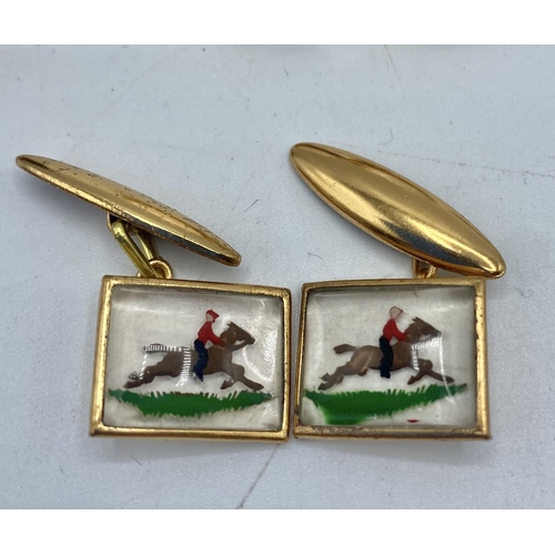49 - A pair of reverse  painted cufflinks with rider and horse together with a matching tie pin and a col... 