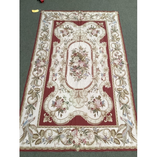 501 - Tapestry style rug, beige with brown borders and centred  flower medallion 150cm x 242 cm