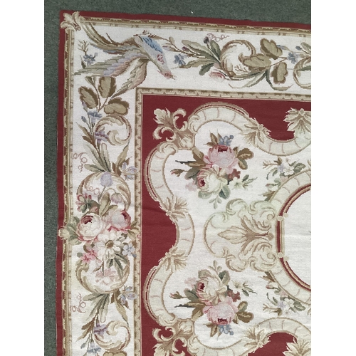 501 - Tapestry style rug, beige with brown borders and centred  flower medallion 150cm x 242 cm