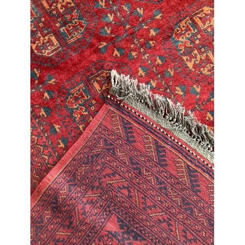 509 - Large red and yellow rug with 18 centred medallion 209 cm x 300 cm