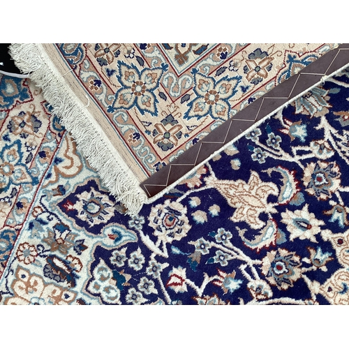 511 - A Persian wool rug,  blue and beige ground, with central star medallion, 114cm x 215cm, cleared from... 