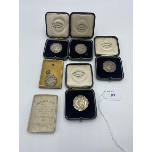 53 - A collection of five sterling silver athletics medals 1920/30s. to KW Hancock. 66g. Four in fitted c... 