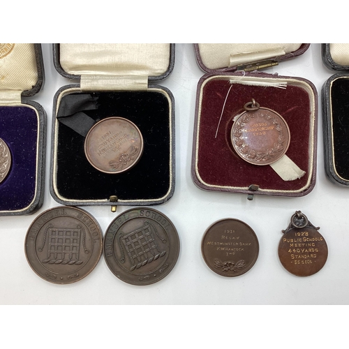 54 - A collection of bronze athletics medals 1920/30s to KW Hancock.