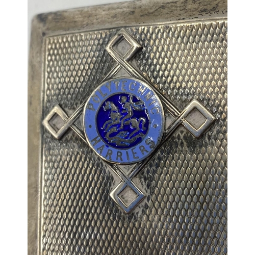 55 - A sterling silver cigarette case with enamel badge. Polytechnic Harriers With matching enamel pendan... 