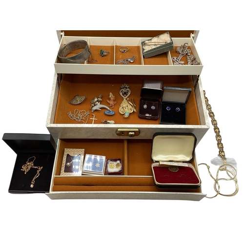 57 - A collection of sterling silver, white metal and costume jewellery in a cream jewellery casket.