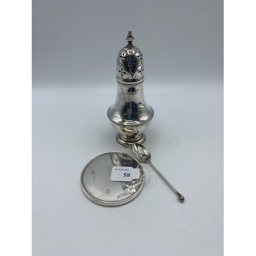 58 - A sterling silver sugar sifter. Birmingham 1911 together with a sterling silver coaster and a silver... 