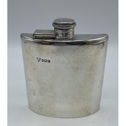61 - A sterling silver hip flask by by G and JW Hawksley, Sheffield 1918. 153.9g. 11.5cm(h)