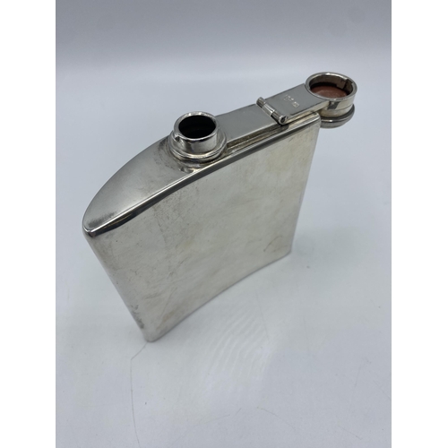 61 - A sterling silver hip flask by by G and JW Hawksley, Sheffield 1918. 153.9g. 11.5cm(h)
