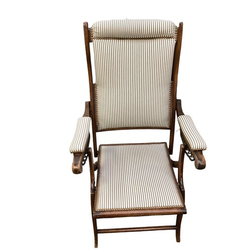 594 - Two Edwardian folding adjustable deck chairs, with studded striped black and white matching fabric