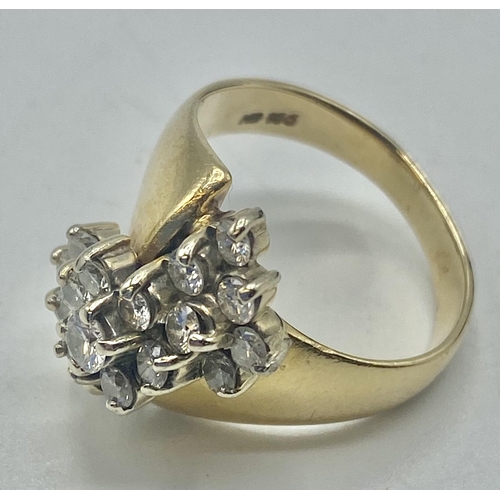 101 - A 14ct gold and diamond dress ring. Set with a cluster of round brilliant cut diamonds. 8.1g size L