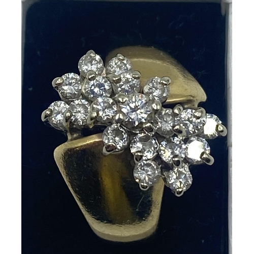 101 - A 14ct gold and diamond dress ring. Set with a cluster of round brilliant cut diamonds. 8.1g size L