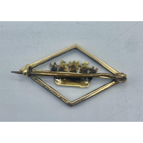 104 - A 15ct gold and enamel lapel brooch marked Page Plymouth. 3.1g. 3.5cm (w)