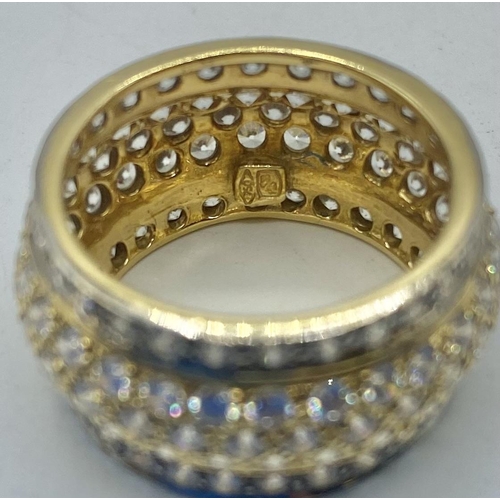 92 - An 18ct gold and diamond full eternity band. Five lines of single cut diamonds. 8.1g. Size N.